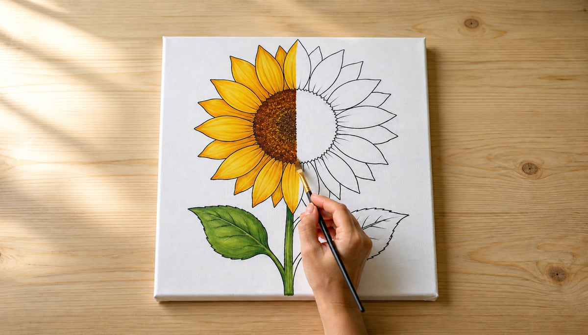 Hand painting a sunflower outline canvas, half finished and half still black outline
