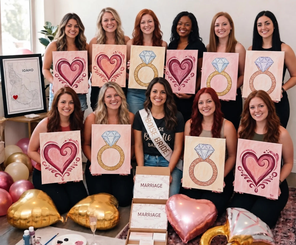 A bridal paint party with heart and ring canvases