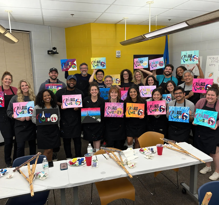 A group sharing their colorful canvases